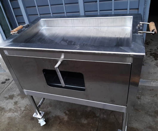 caja china y parrillas de acero inoxidable